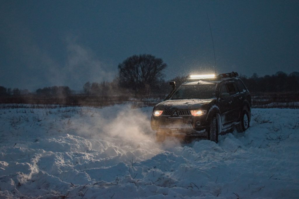 car stranded in snowy road